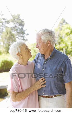 Senior couple smiling at each other View Large Photo Image Stock Photograph - Senior couple smiling at each other. Fotosearch
