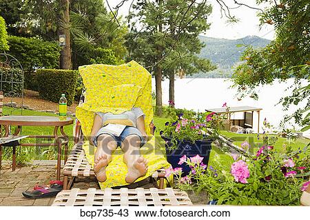 Woman in lounge chair with blanket over face View Large Photo Image Stock Image - Woman in lounge chair with blanket over face. Fotosearch