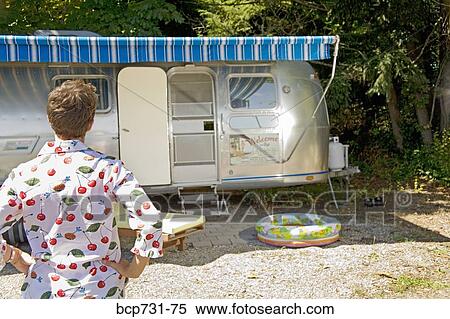 Woman looking at motor home View Large Photo Image Stock Photography - Woman looking at motor home. Fotosearch