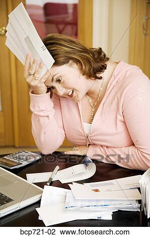 Woman paying her bills View Large Photo Image Stock Image - Woman paying her bills. Fotosearch