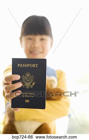 Young girl holding teddy bear and passport View Large Photo Image Stock Photograph - Young girl holding teddy bear and passport. Fotosearch