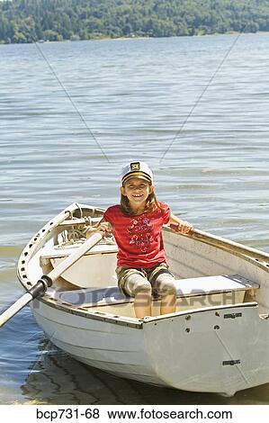 Young girl in row boat View Large Photo Image Stock Photo - Young girl in row boat. Fotosearch