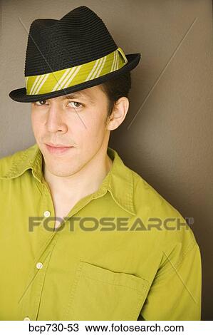 Young man wearing hat View Large Photo Image Stock Image - Young man wearing hat. Fotosearch