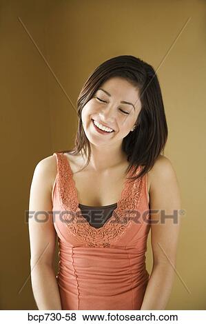 Young woman laughing View Large Photo Image Stock Photo - Young woman laughing. Fotosearch