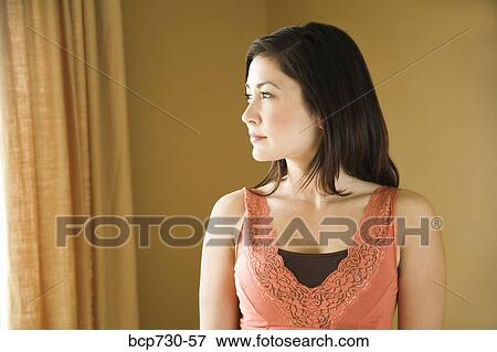 Young woman looking to side View Large Photo Image Stock Photo - Young woman looking to side. Fotosearch