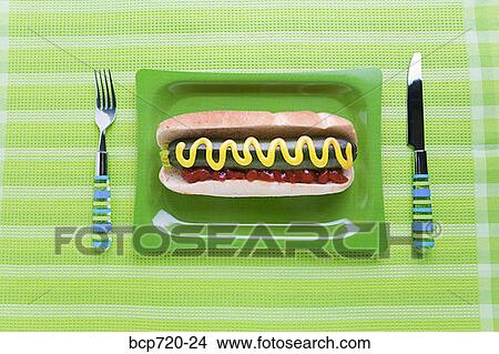 Picture - Zucchini in hot dog bun. Fotosearch