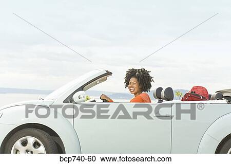 African woman driving convertible car View Large Photo Image Stock Image - African woman driving convertible car. Fotosearch