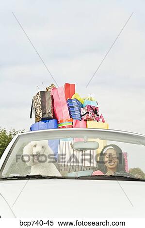 African woman in convertible with shopping bags View Large Photo Image Stock Photography - African woman in convertible with shopping bags. Fotosearch