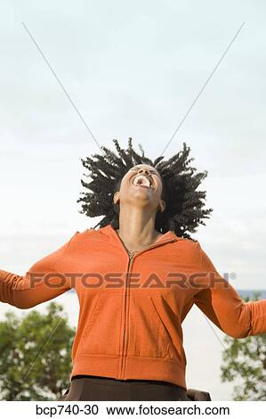 African woman laughing with head back View Large Photo Image Stock Image - African woman laughing with head back. Fotosearch