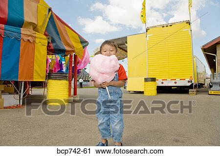 Asian boy eating cotton candy View Large Photo Image Stock Image - Asian boy eating cotton candy. Fotosearch