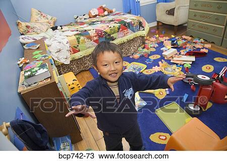 Asian boy in messy bedroom View Large Photo Image Stock Image - Asian boy in messy bedroom. Fotosearch