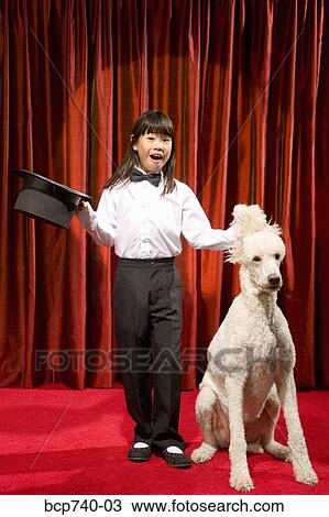 Asian girl with top hat and dog on stage View Large Photo Image Stock Image - Asian girl with top hat and dog on stage. Fotosearch