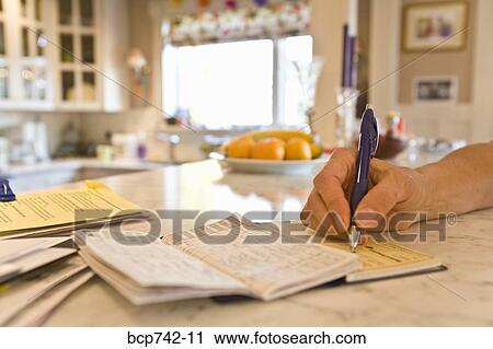 Close up of person writing check View Large Photo Image Stock Image - Close up of person writing check. Fotosearch