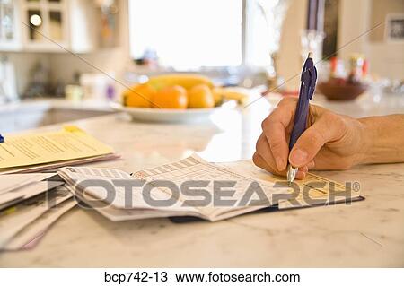 Close up of person writing check View Large Photo Image Stock Image - Close up of person writing check. Fotosearch
