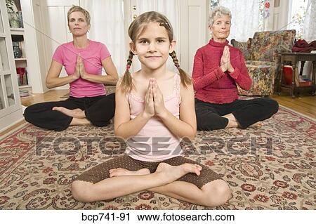 Grandmother, mother and daughter practicing yoga View Large Photo Image Stock Image - Grandmother, mother and daughter practicing yoga. Fotosearch