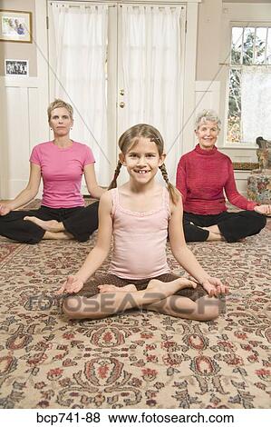 Grandmother, mother and daughter practicing yoga View Large Photo Image Stock Photo - Grandmother, mother and daughter practicing yoga. Fotosearch