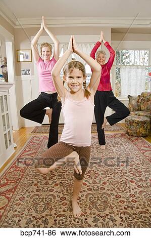 Grandmother, mother and daughter practicing yoga View Large Photo Image Stock Photograph - Grandmother, mother and daughter practicing yoga. Fotosearch