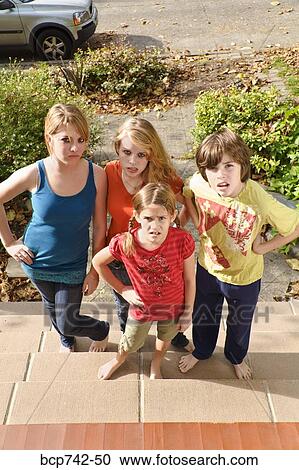 Group of siblings making faces View Large Photo Image Stock Image - Group of siblings making faces. Fotosearch