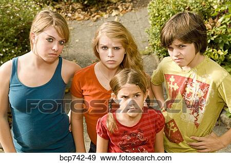 Group of siblings making faces View Large Photo Image Stock Photo - Group of siblings making faces. Fotosearch