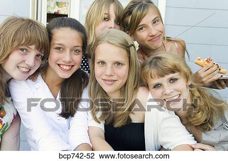 Group of teenaged girls hugging View Large Photo Image Stock Image - Group of teenaged girls hugging. Fotosearch