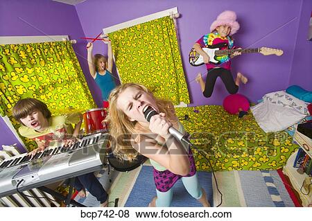 Stock Photo - Kids playing instruments in band. Fotosearch