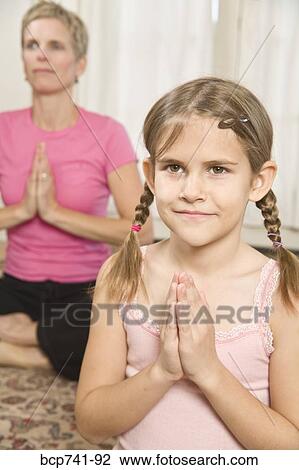 Mother and daughter practicing yoga View Large Photo Image Stock Image - Mother and daughter practicing yoga. Fotosearch