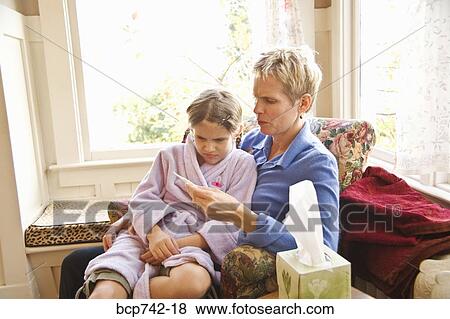 Mother taking sick daughter’s temperature View Large Photo Image Stock Photo - Mother taking sick daughter’s temperature. Fotosearch