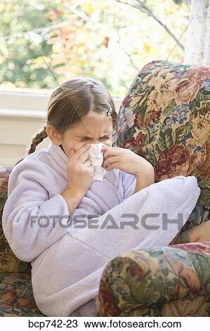 Sick girl blowing nose View Large Photo Image Stock Image - Sick girl blowing nose. Fotosearch
