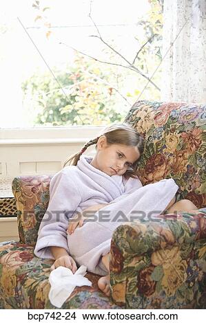 Picture - Sick girl sitting in armchair. Fotosearch