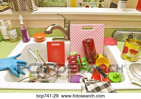 Sink filled with dirty dishes View Large Photo Image Stock Photo - Sink filled with dirty dishes. Fotosearch