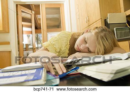 Teenage girl sleeping on school books View Large Photo Image Stock Image - Teenage girl sleeping on school books. Fotosearch