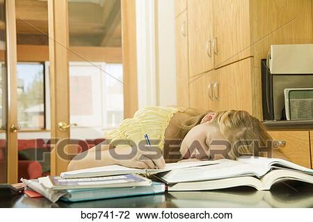 Teenage girl sleeping on school books View Large Photo Image Stock Image - Teenage girl sleeping on school books. Fotosearch