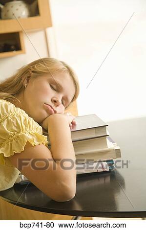 Teenage girl sleeping on stack of school books View Large Photo Image Stock Image - Teenage girl sleeping on stack of school books. Fotosearch