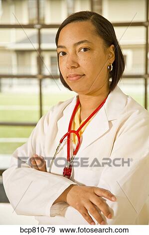African female doctor with arms crossed View Large Photo Image Stock Photo - African female doctor with arms crossed. Fotosearch