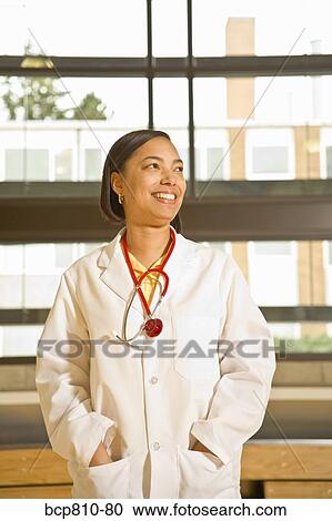 African female doctor with hands in pockets View Large Photo Image Stock Image - African female doctor with hands in pockets. Fotosearch