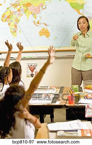 African female teacher calling on student View Large Photo Image Stock Photo - African female teacher calling on student. Fotosearch