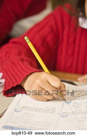 Stock Photo - African girl doing homework. Fotosearch