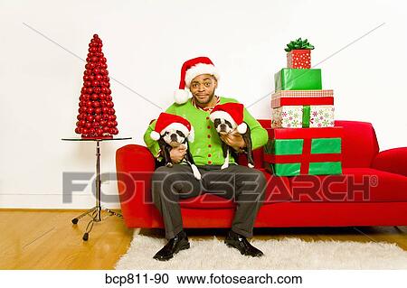 African man and dogs wearing Santa Claus hats View Large Photo Image Stock Image - African man and dogs wearing Santa Claus hats. Fotosearch