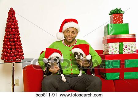 African man and dogs wearing Santa Claus hats View Large Photo Image Stock Image - African man and dogs wearing Santa Claus hats. Fotosearch