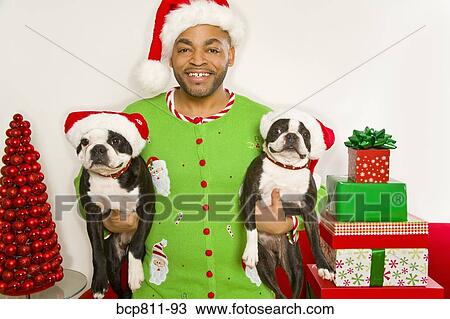 African man and dogs wearing Santa Claus hats View Large Photo Image Stock Image - African man and dogs wearing Santa Claus hats. Fotosearch