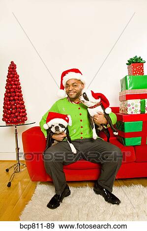 African man and dogs wearing Santa Claus hats View Large Photo Image Stock Photo - African man and dogs wearing Santa Claus hats. Fotosearch