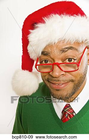 African man wearing Santa Claus hat View Large Photo Image Stock Photo - African man wearing Santa Claus hat. Fotosearch