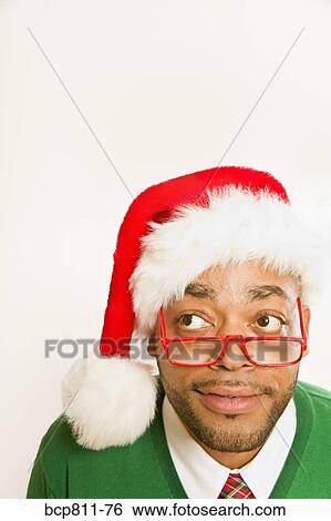 African man wearing Santa Claus hat View Large Photo Image Stock Photograph - African man wearing Santa Claus hat. Fotosearch
