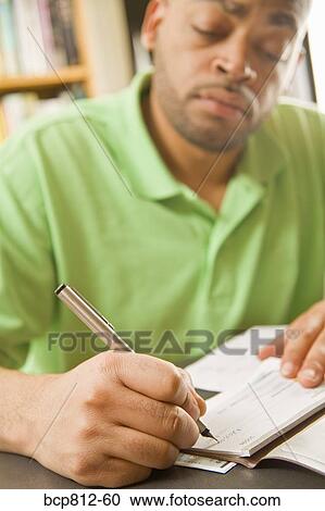 African man writing check View Large Photo Image Stock Image - African man writing check. Fotosearch