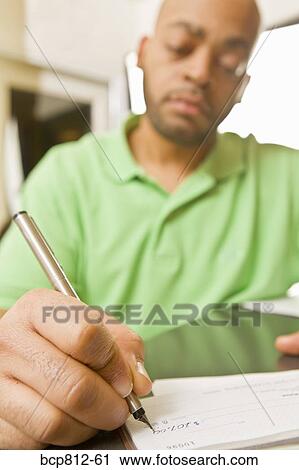 African man writing check View Large Photo Image Stock Image - African man writing check. Fotosearch