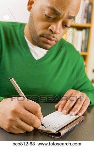 African man writing check View Large Photo Image Stock Image - African man writing check. Fotosearch