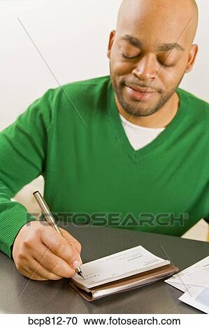 African man writing check View Large Photo Image Stock Image - African man writing check. Fotosearch