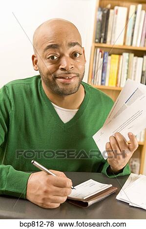 African man writing check View Large Photo Image Stock Photo - African man writing check. Fotosearch
