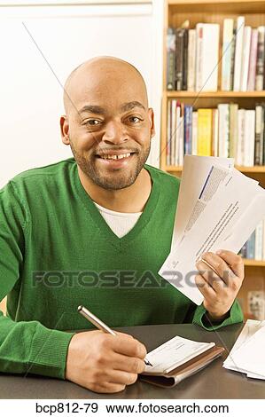 African man writing check View Large Photo Image Stock Photo - African man writing check. Fotosearch