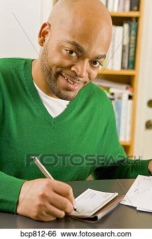 African man writing check View Large Photo Image Stock Photograph - African man writing check. Fotosearch